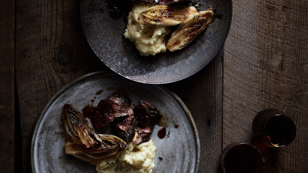 Hangar Steak With Caramelized Endive and Roasted Garlic Mashed Potatoes